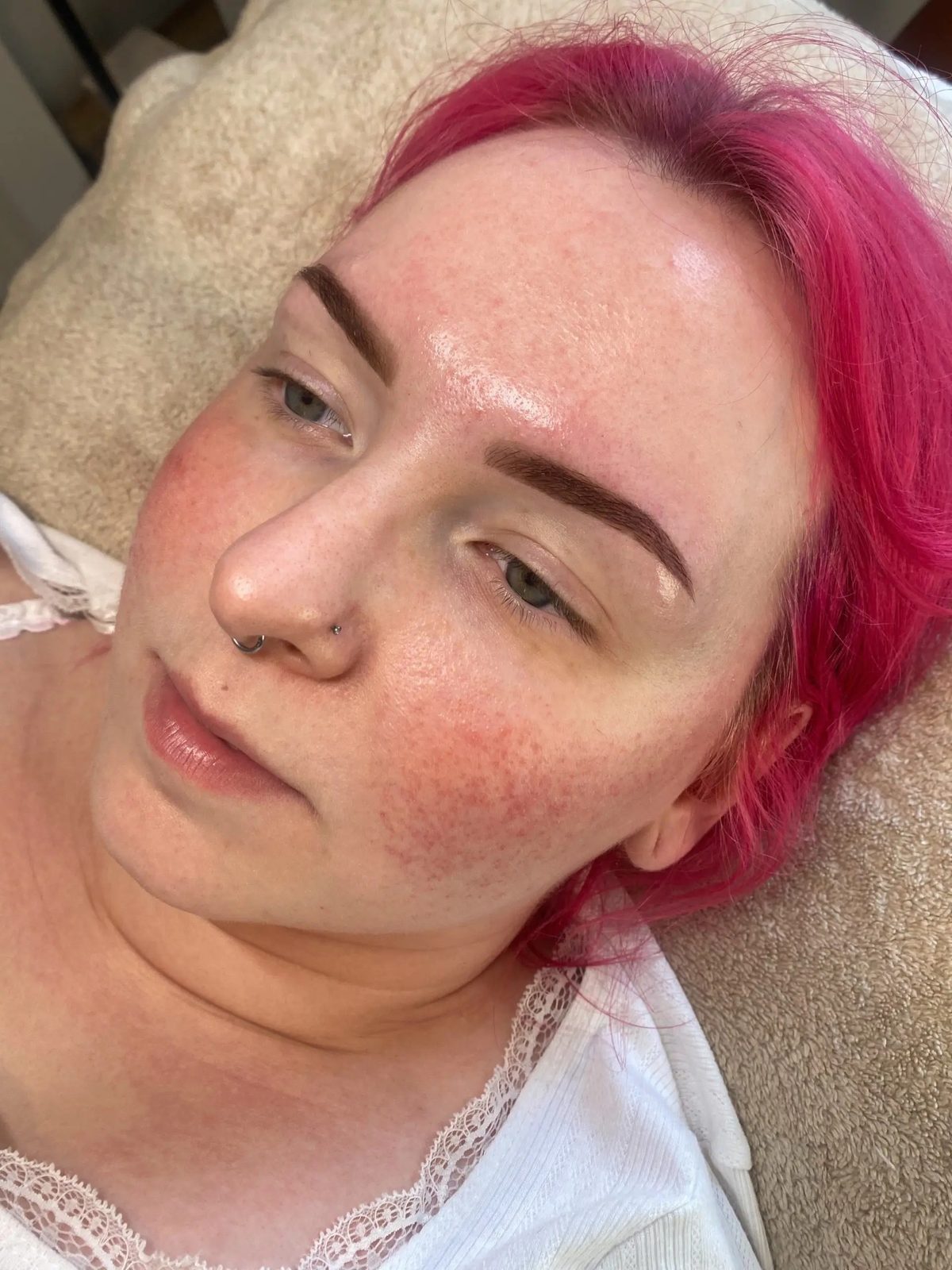 Defined brows on a client with pink hair